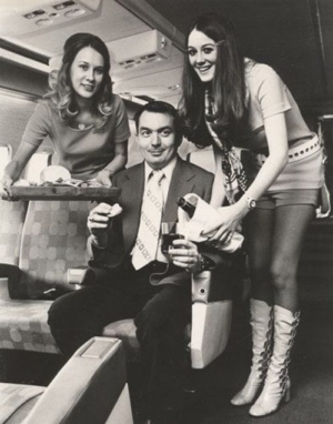 Photo of two beautiful Southwest Airlines stewardesses with long lean legs.