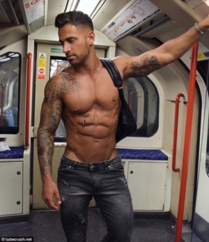 Eye Candy: photo of well-built but topless young man on London Underground.